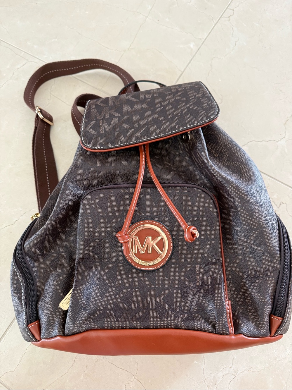 Michael Kors Brown Monogram Backpack with Chestnut Trim and Gold MK Badge